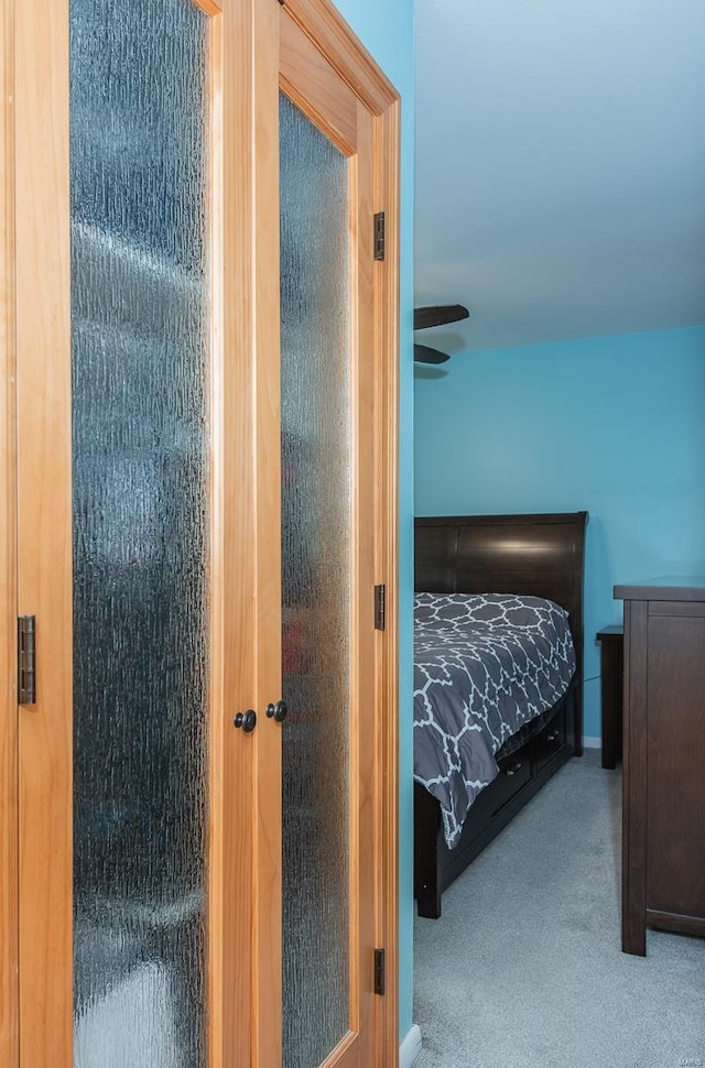 carpeted bedroom with baseboards
