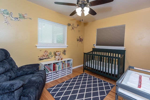 bedroom with wood finished floors and ceiling fan