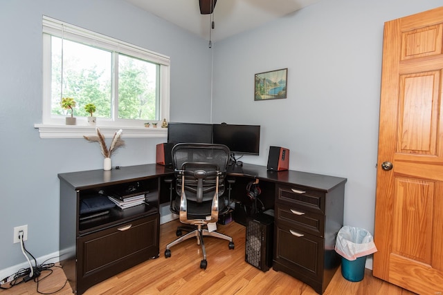 office with baseboards, light wood-style floors, and ceiling fan