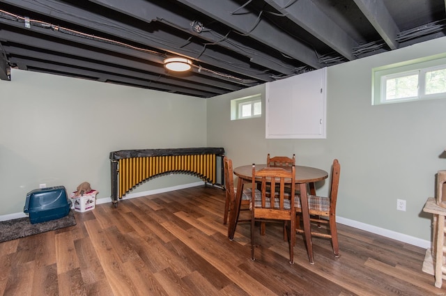 dining area with a wealth of natural light, wood finished floors, and baseboards