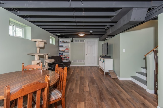 dining space featuring stairway, dark wood-style flooring, baseboards, and visible vents