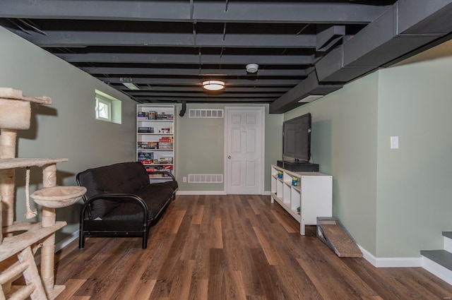 sitting room featuring dark wood finished floors, visible vents, and baseboards