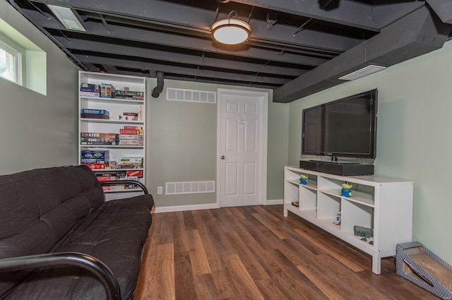 living room featuring dark wood-style floors and visible vents