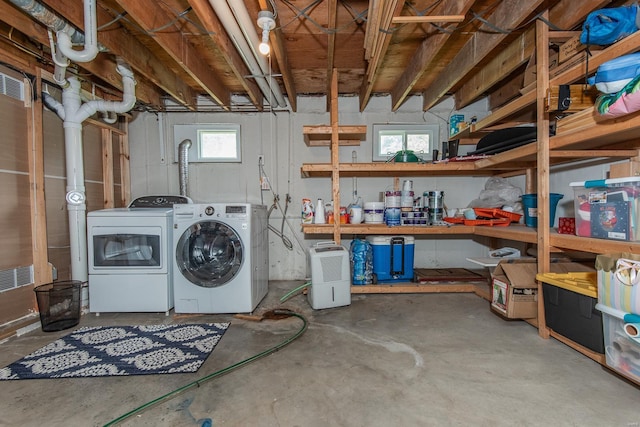 laundry area featuring washing machine and dryer and laundry area