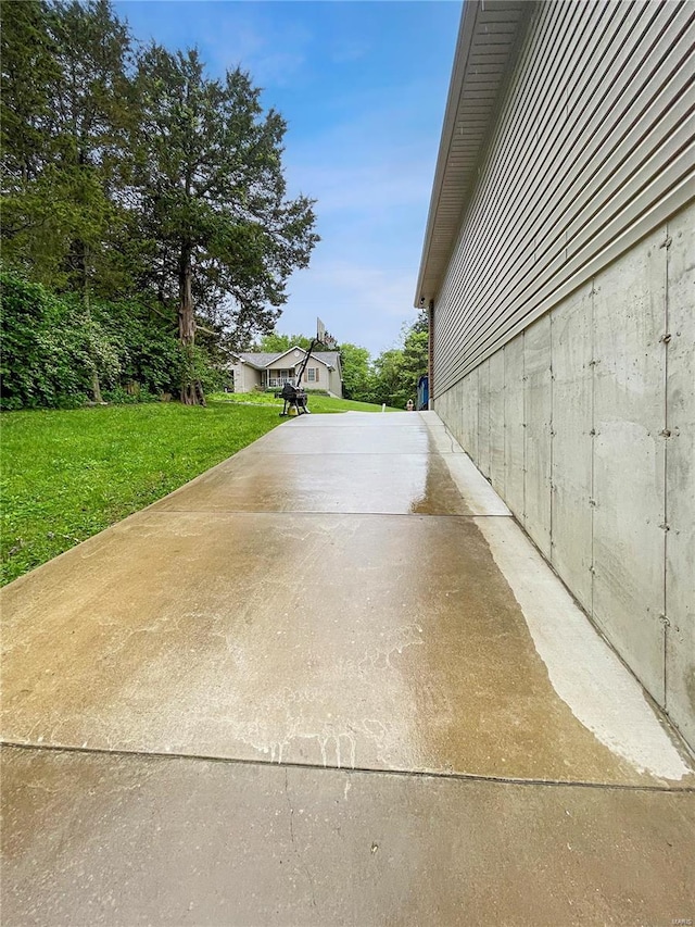 view of home's exterior with a lawn