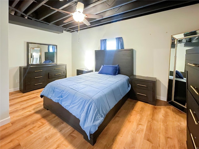 bedroom with baseboards, a ceiling fan, and light wood finished floors