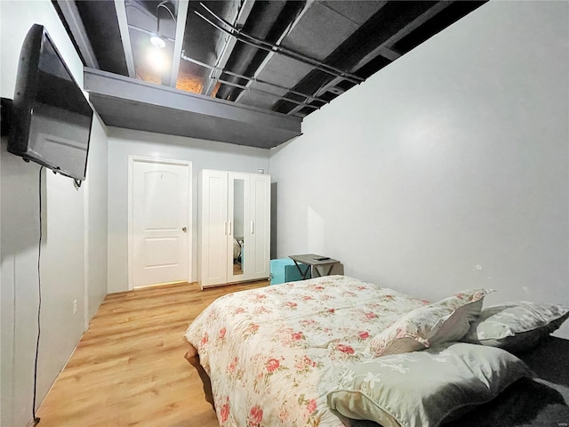 bedroom with wood finished floors