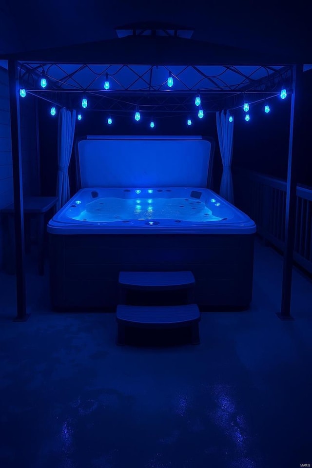 patio at night with a hot tub