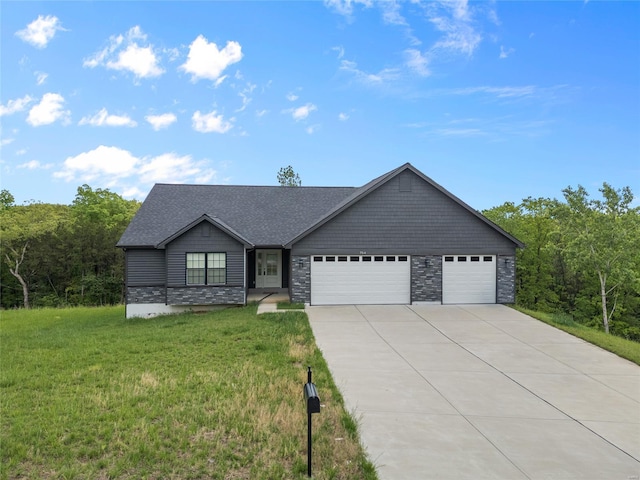 single story home featuring a garage, concrete driveway, a front yard, and stone siding