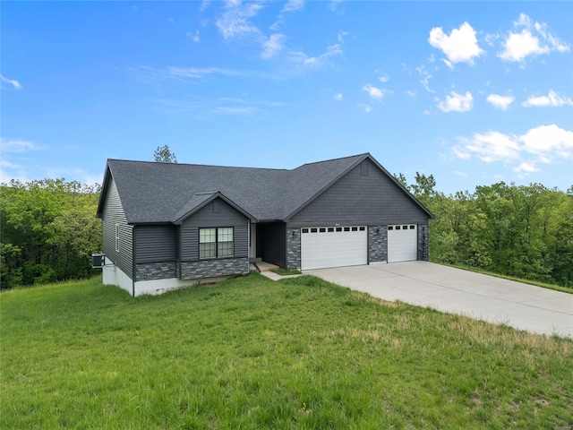 ranch-style house with roof with shingles, stone siding, a garage, a front yard, and concrete driveway