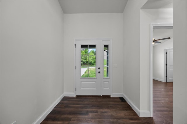 entryway with dark wood-style flooring and baseboards
