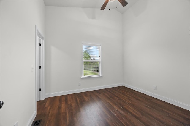 unfurnished room featuring ceiling fan, dark wood-style floors, baseboards, and high vaulted ceiling