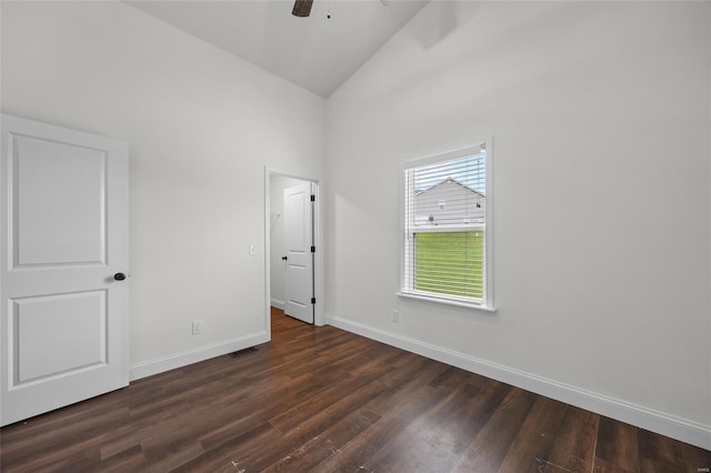 unfurnished bedroom with ceiling fan, visible vents, high vaulted ceiling, baseboards, and dark wood-style floors