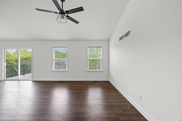 spare room with ceiling fan, visible vents, wood finished floors, baseboards, and high vaulted ceiling