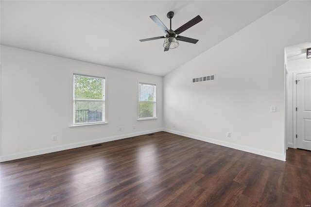 spare room featuring ceiling fan, visible vents, dark wood-style floors, and baseboards