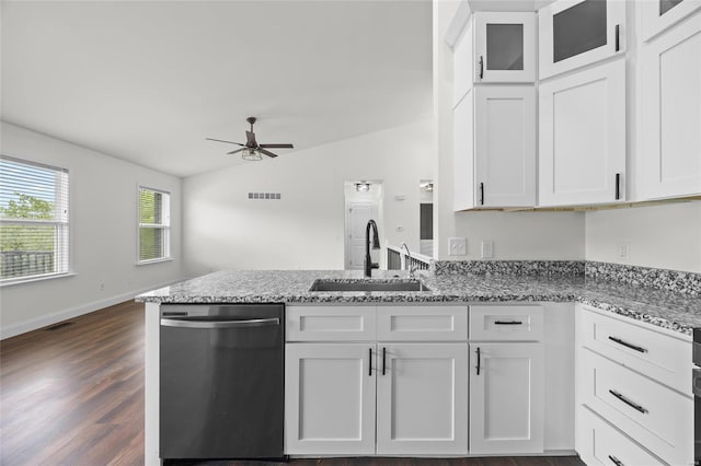 kitchen with a ceiling fan, a peninsula, white cabinetry, a sink, and dishwasher