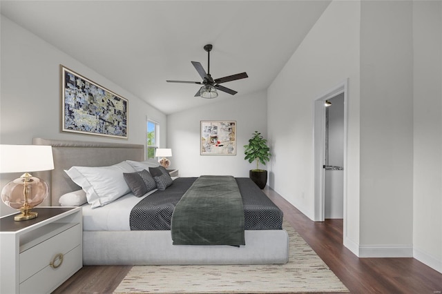 bedroom with a ceiling fan, baseboards, vaulted ceiling, and dark wood-type flooring