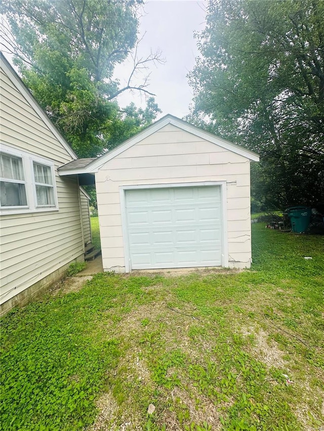 detached garage featuring driveway