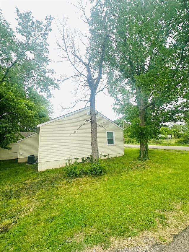 view of property exterior with a lawn