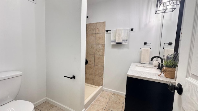 full bathroom with toilet, a shower stall, tile patterned flooring, and vanity