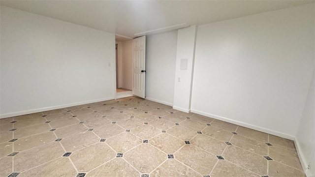 empty room with baseboards