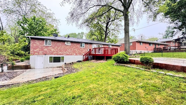 back of house featuring a lawn, central AC, fence, and a wooden deck