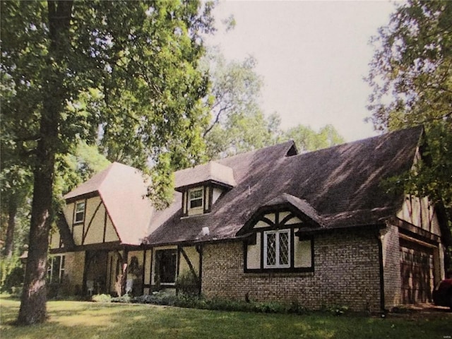 rear view of house with a lawn