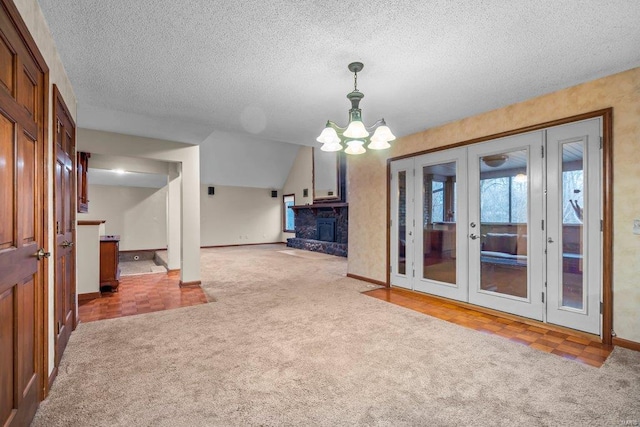 unfurnished living room featuring baseboards, french doors, a wealth of natural light, and carpet