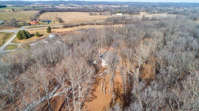 birds eye view of property with a rural view