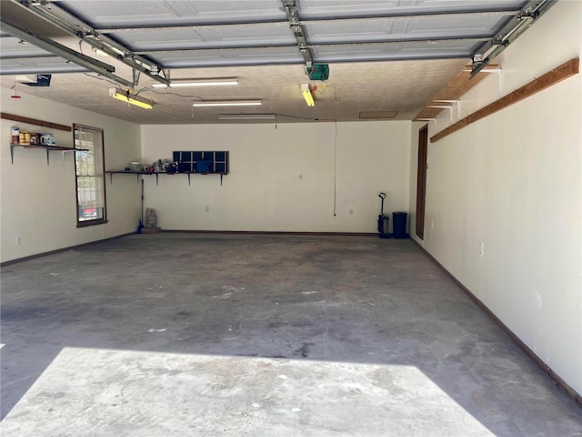 garage featuring baseboards and a garage door opener