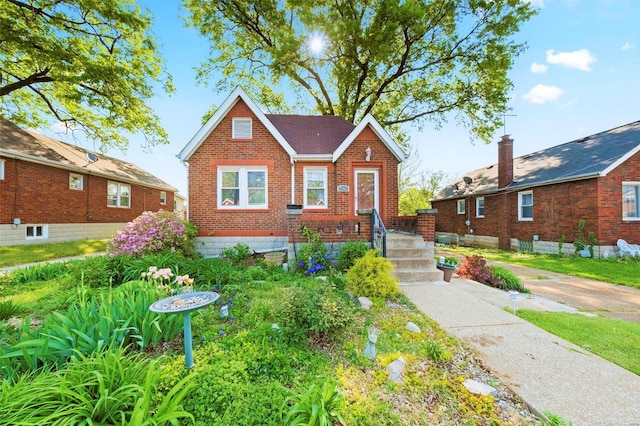 view of front of house with brick siding