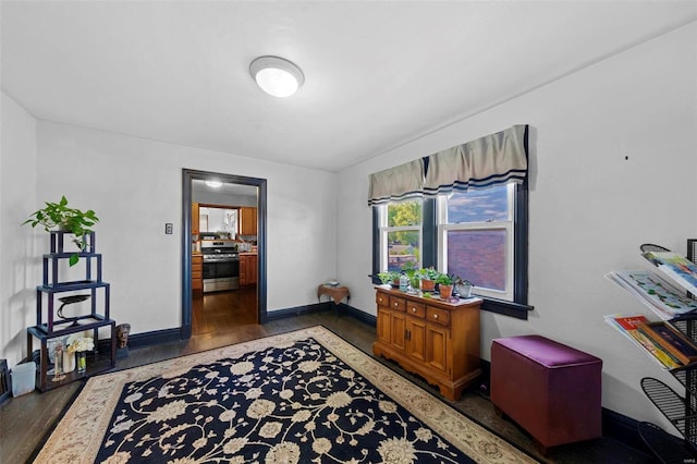 home office featuring baseboards and wood finished floors
