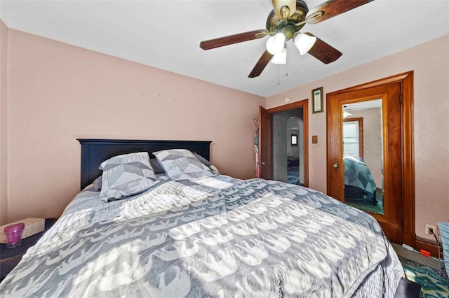 carpeted bedroom with a ceiling fan