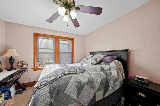 bedroom featuring carpet flooring, a ceiling fan, baseboards, and cooling unit