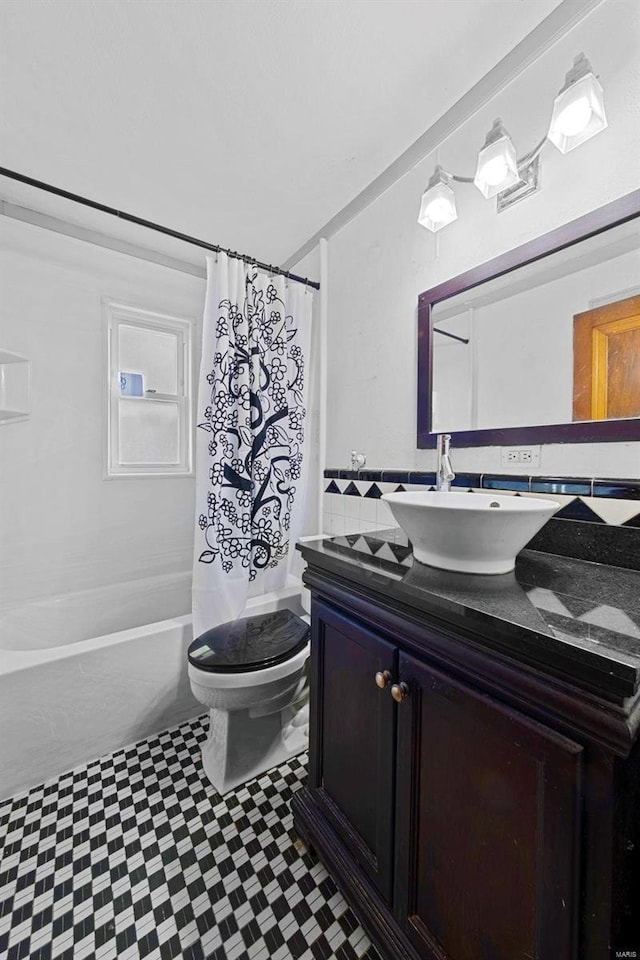 bathroom with vanity, tile patterned floors, toilet, and shower / tub combo