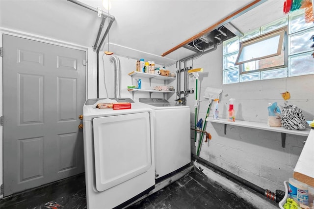 laundry room with washing machine and clothes dryer and laundry area
