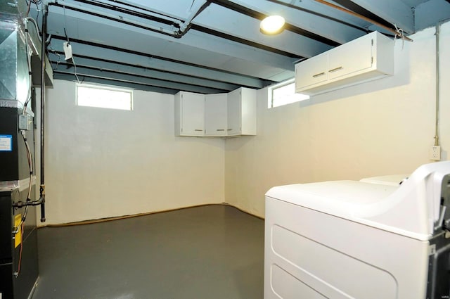laundry area featuring separate washer and dryer and laundry area