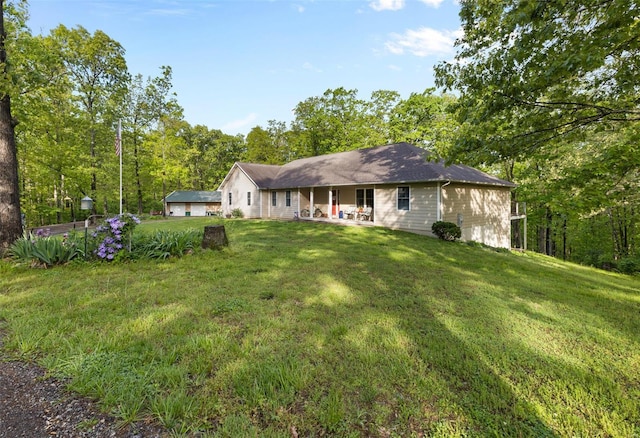 rear view of property with a lawn