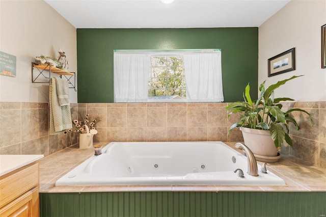 bathroom featuring a jetted tub and vanity
