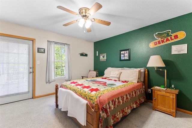 bedroom with carpet, baseboards, and a ceiling fan