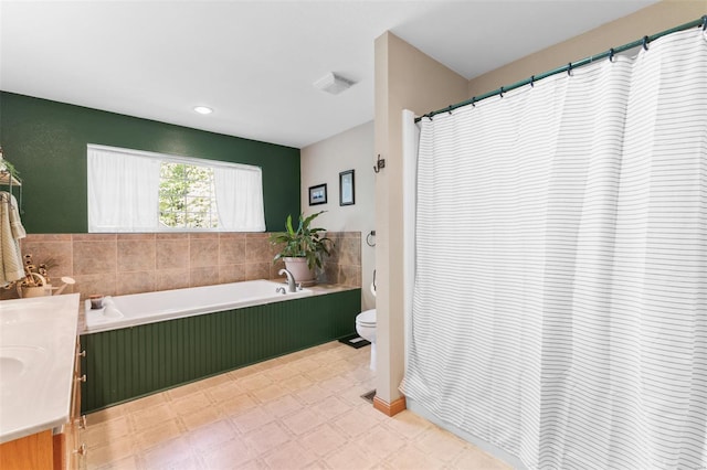 full bathroom with vanity, toilet, a garden tub, and tile patterned floors