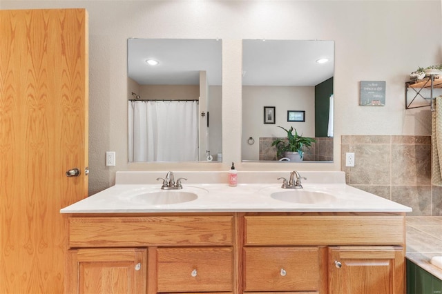 full bathroom featuring double vanity, a sink, and a shower with shower curtain