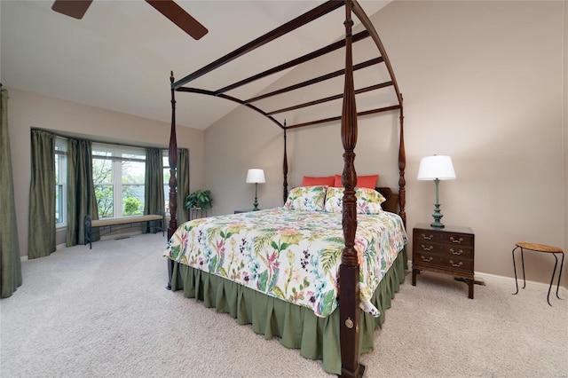 bedroom featuring carpet floors, baseboards, vaulted ceiling, and ceiling fan