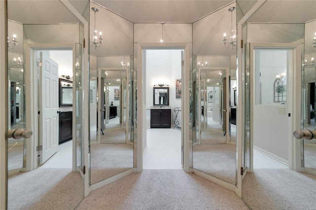 interior space with carpet and a chandelier