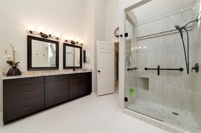 bathroom featuring vanity and a tile shower