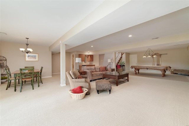 living room featuring visible vents, pool table, a notable chandelier, light carpet, and stairs