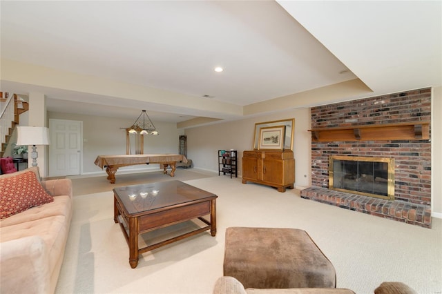 living area with pool table, baseboards, light carpet, and a brick fireplace