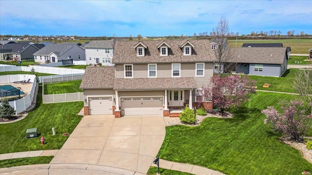 view of front of property with driveway, a residential view, fence, a front lawn, and a shingled roof