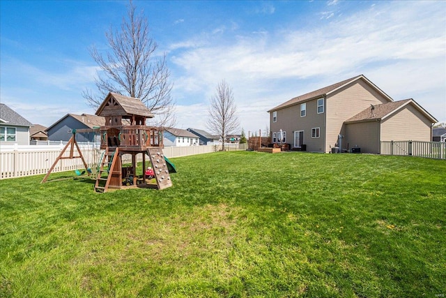 view of yard featuring a fenced backyard and a playground