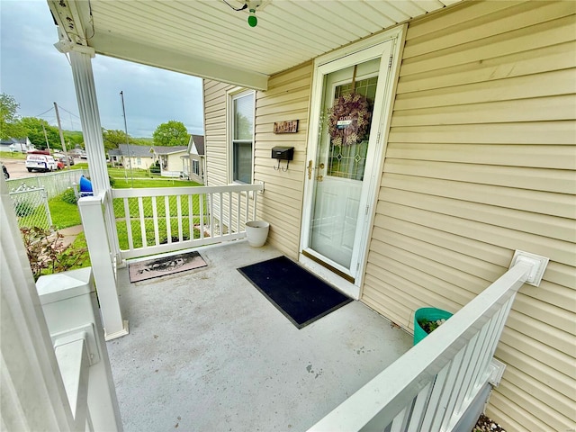 entrance to property featuring a porch